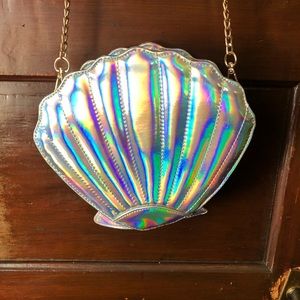 Iridescent silver clam shell cross body bag